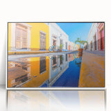 Acrylic print of a Yucatan scenery with bright blues and greens, framed in white.