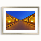 Textured abstract art print of a Middle Eastern scenery in muted earth tones, framed in silver, ideal for bedroom art.