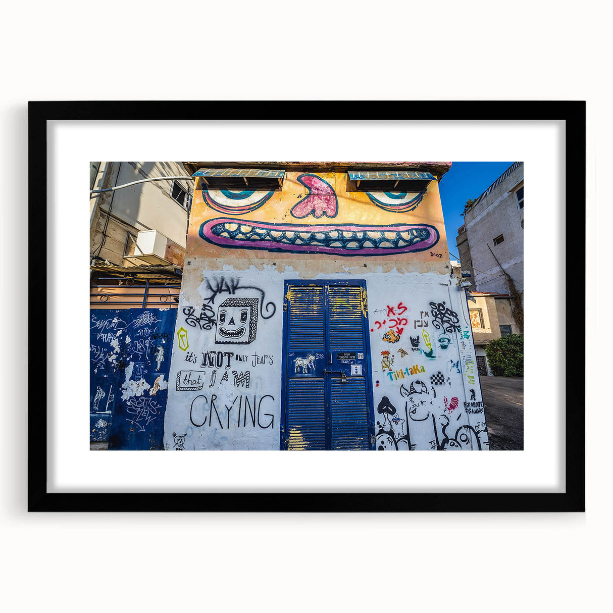 Extra large abstract art print of Tel Aviv skyline with vibrant, colorful textures on a framed black mat.