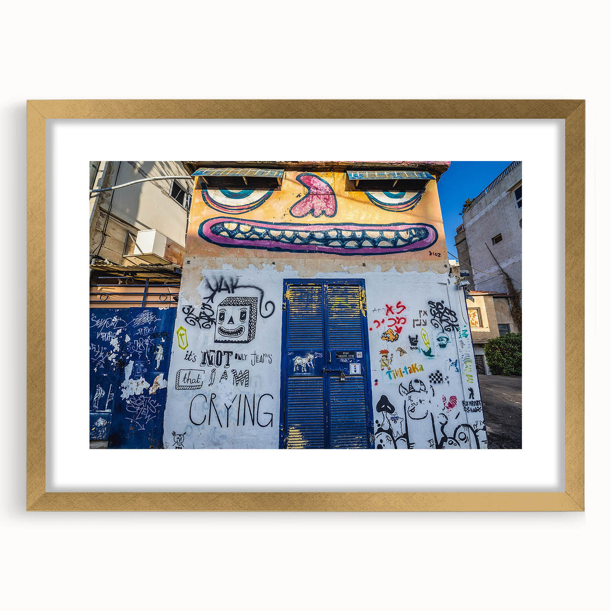 Extra large abstract art print of Tel Aviv skyline in textured gold frame, using soft pastel shades.
