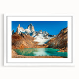 Abstract art print depicting a stylized Argentine landscape in muted earth tones on a framed white mat.