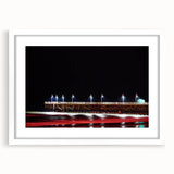 Abstract art print of Daytona scenery in muted gray and blue tones on a framed white mat, ideal for dining room decor.