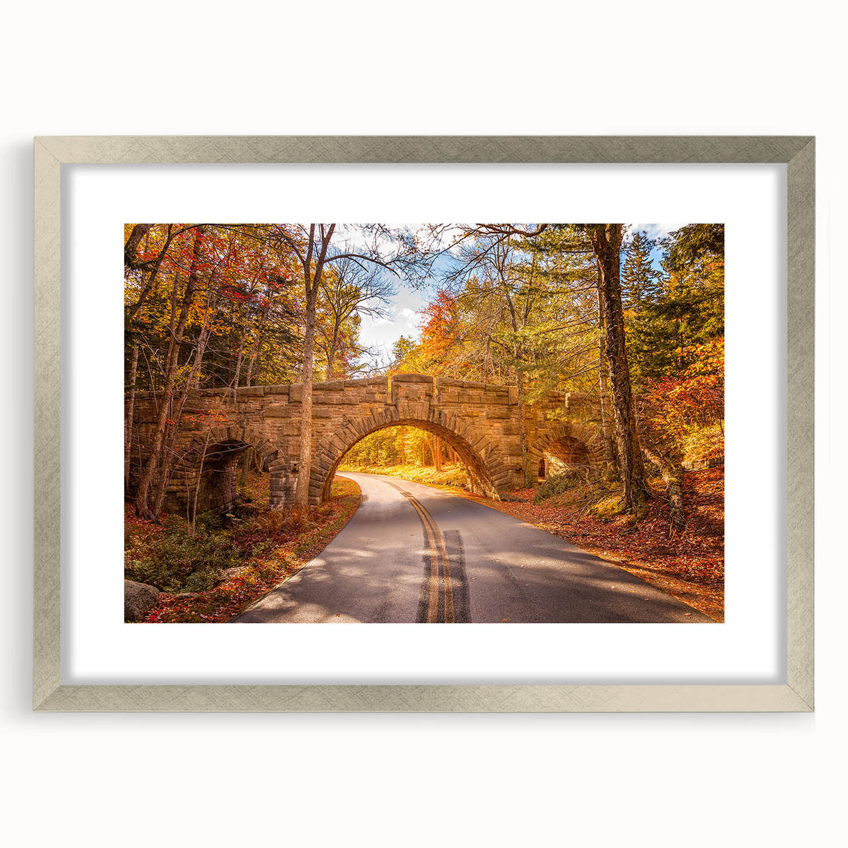 Textured art print of Acadia's rugged coastline in muted earth tones, framed in silver, ideal for bedroom decor.