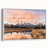Vintage poster art of the Grand Tetons on a framed canvas, featuring vibrant colors, ideal for living room decor.