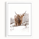 Abstract art print depicting winter season in muted blue and white tones on a framed canvas.