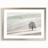 Abstract landscape artwork framed in a silver mat, showcasing a serene blend of soft blues and greens, perfect for modern home decor and artistic displays.