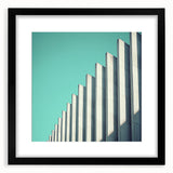 Abstract landscape artwork framed with a sleek black mat, showcasing vibrant colors and fluid shapes, perfect for modern home decor or office settings.