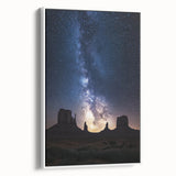 Framed canvas artwork depicting a serene desert landscape with warm earth tones, showcasing cacti and mountains, ideal for home decor in neutral settings.