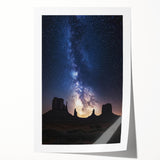 Desert landscape rolled print showcasing vibrant hues of orange and yellow with intricate details of sand dunes and a serene blue sky, packaged securely in a protective tube.