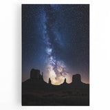 Stretched canvas artwork depicting a vibrant desert landscape, featuring warm hues of orange and yellow with cacti and mountains, ideal for enhancing home decor.