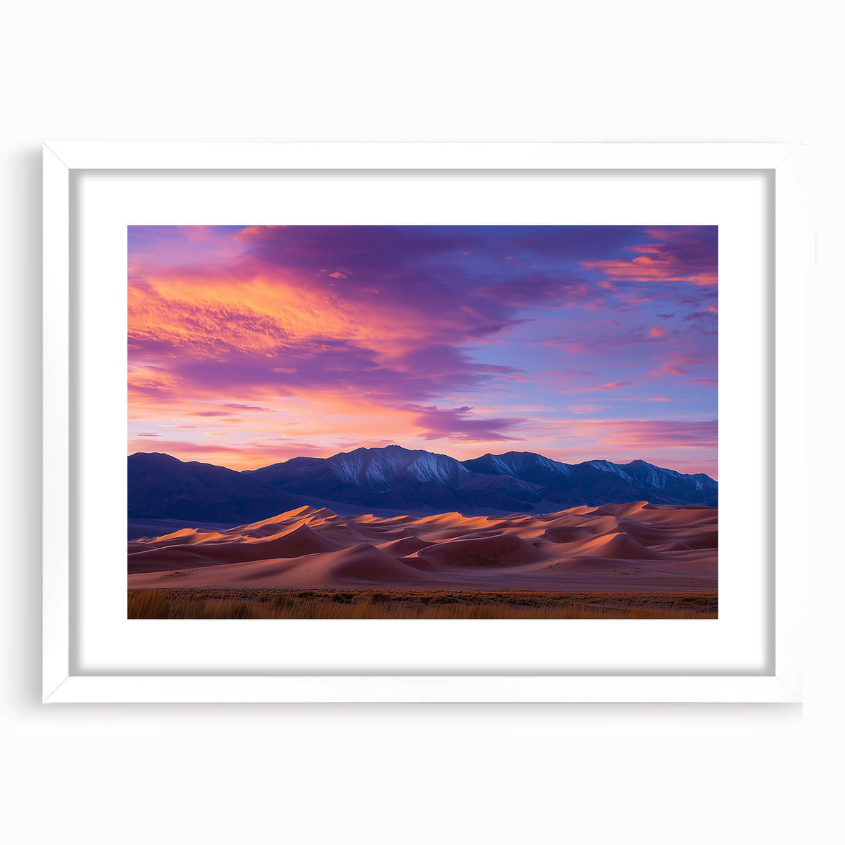 Framed landscape artwork depicting serene sand dunes in soft beige and golden hues, set in a white mat for an elegant presentation, perfect for home decor.