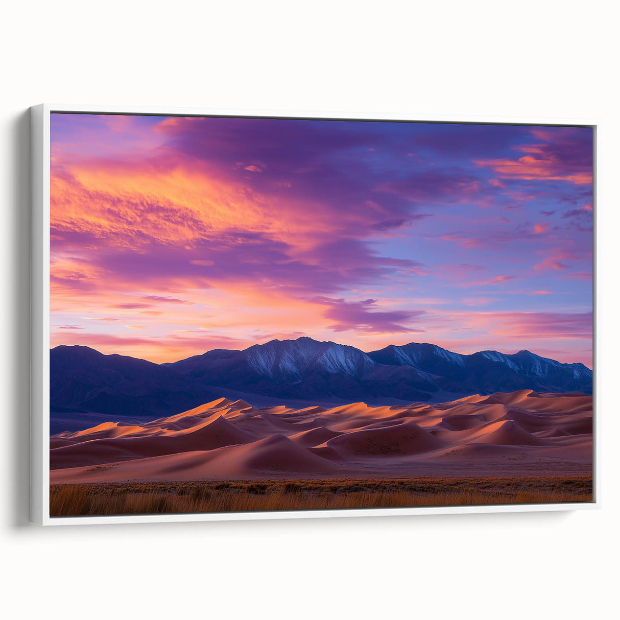 Framed canvas artwork depicting serene sand dunes in soft beige and golden hues, showcased in a stylish white frame, perfect for modern home decor.