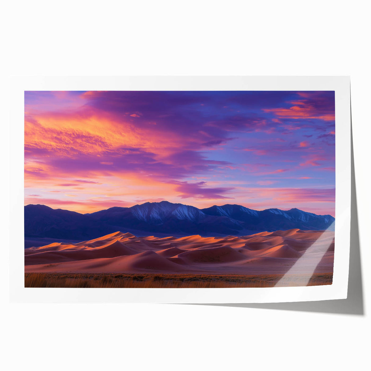Vibrant rolled canvas print showcasing serene desert dunes at sunset, featuring warm hues of orange and yellow, elegantly packaged in a protective cardboard tube.