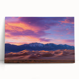 Stretched canvas artwork depicting serene sand dunes under a vibrant sunset, showcasing warm golden and orange hues, perfect for enhancing home decor.