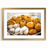 Abstract art print of a Moroccan landscape in gold frame, featuring earthy tones, ideal for dining room decor.