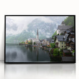 Large abstract wall art depicting a stylized European landscape in muted earth tones, framed in black acrylic.