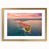 Abstract art print of a European landscape in muted gold and green tones, framed with a gold mat.