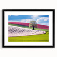 Colorful abstract art print of a European scenery in vibrant hues, on a large textured canvas with a black frame.