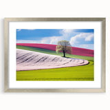 Extra large wall art featuring an abstract textured print of a European scenery in muted earth tones, framed in silver.