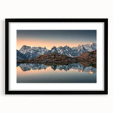 Colorful abstract art print of the French Alps in a black frame with mat, ideal for living room decor.