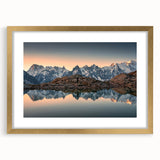 Abstract art print of the French Alps in muted blue and green tones on a framed canvas, suited for dining room decor.