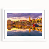 Textured art depicting an abstract European landscape in muted earth tones, framed with a white mat, ideal for bedroom art.