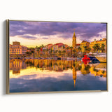 Framed canvas featuring a vintage-style landscape painting of southern France in muted earth tones.