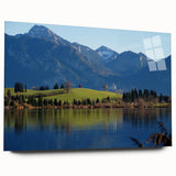 Large abstract wall art of Bavarian scenery in muted green and blue tones on acrylic glass.