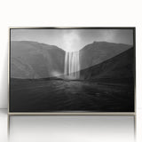 Large art print of a serene Icelandic landscape with muted blue and green tones, in a silver-framed acrylic.