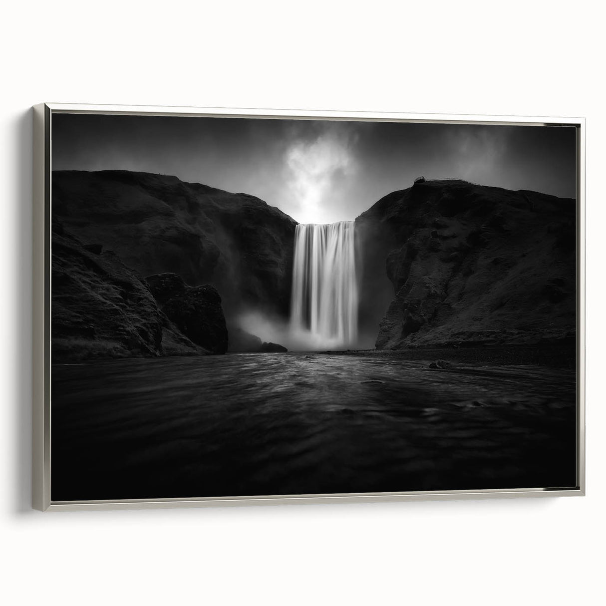 Framed canvas featuring a vintage-style landscape painting of Icelandic scenery, with muted earth tones and a black frame.