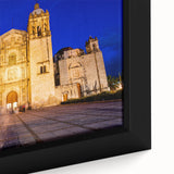 Framed canvas featuring a textured depiction of Oaxaca, Mexico in black with vibrant, colorful accents.