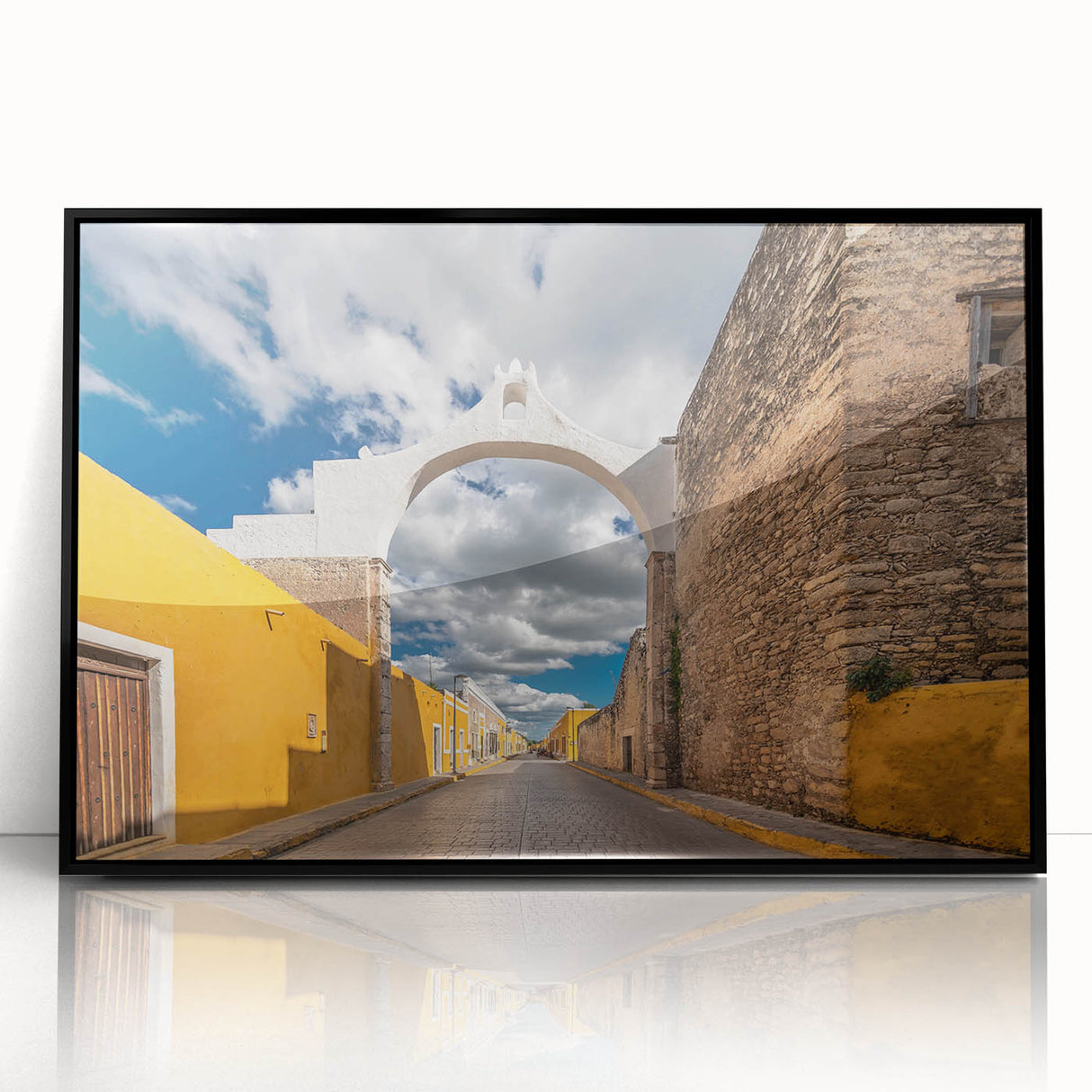Large abstract wall art depicting Yucatan scenery in muted earth tones on a black framed acrylic.