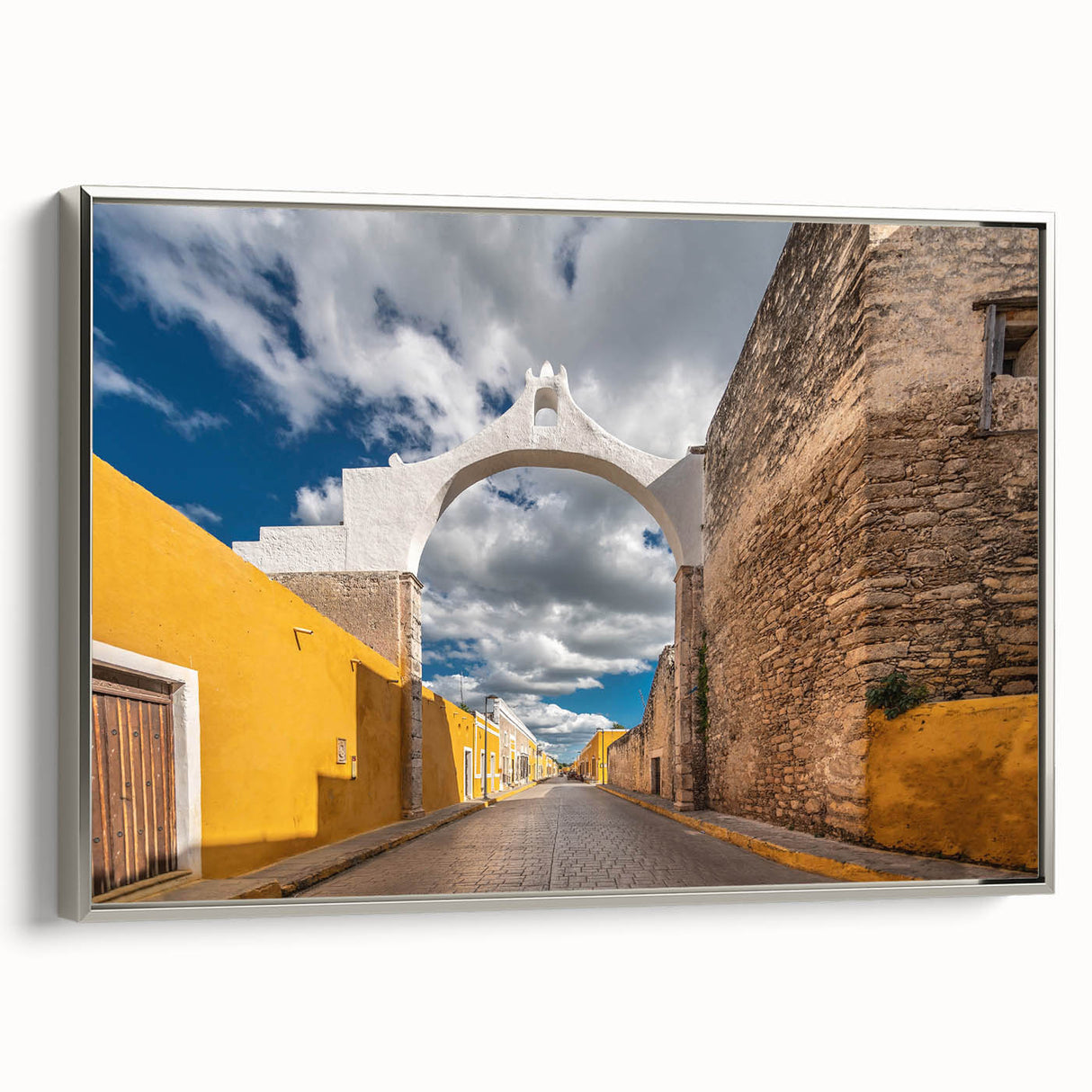 Framed canvas wall art depicting a vintage-style Yucatan landscape in muted earth tones, ideal for bedroom decor.