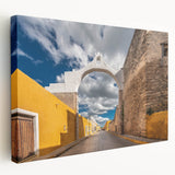 A stretched canvas featuring a vibrant scene of Yucatán, Mexico, with lush greenery and a serene lake.