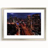 Textured abstract art print of Tel Aviv skyline in muted gray and blue tones on a framed canvas, suitable for bedroom decor.