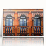 Acrylic print of a Middle-Eastern scenery in muted earth tones, framed in white, suitable for modern art wall decor.