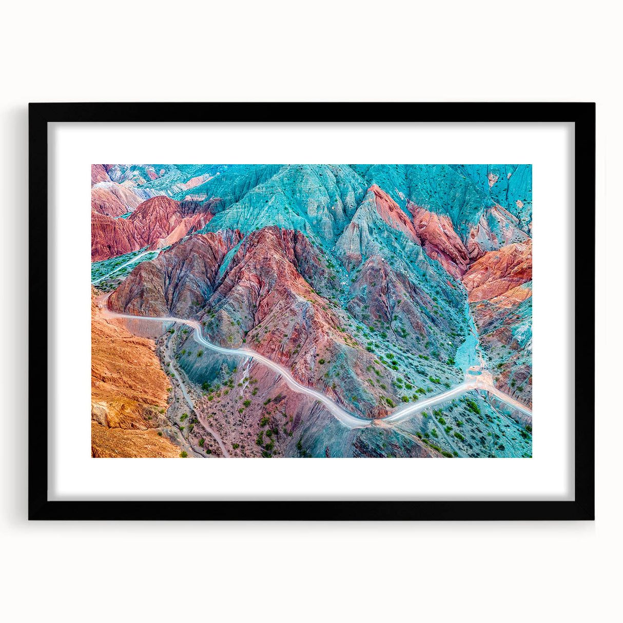 Extra large abstract art print depicting a colorful, textured scene of South America, in a black frame with mat.