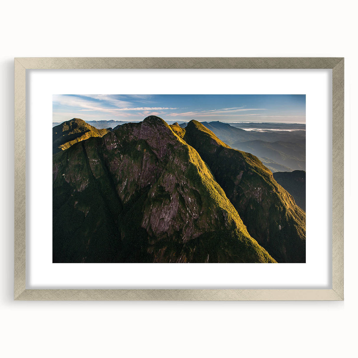 Textured abstract art print of a stylized Brazilian landscape in muted earth tones, framed in silver.