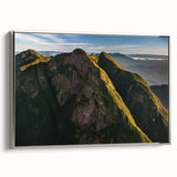 Framed canvas landscape art painting of a Brazilian scenery in vibrant colors, set in a silver frame.