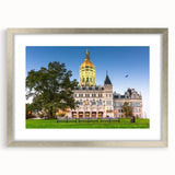 Textured abstract art print of Connecticut scenery in muted earth tones, framed with a silver mat.