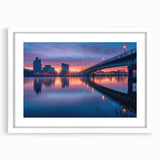 Abstract art print of Delaware scenery in muted green and blue hues on a framed white mat, suitable for dining room decor.