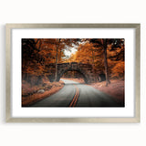 Textured abstract art print depicting Acadia's rugged coast in muted earth tones, framed in silver, ideal for bedroom art.