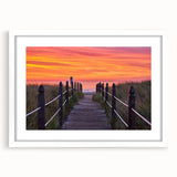 Abstract art print of a Maine coastline in muted blue and gray tones on a framed white mat, ideal for dining room decor.