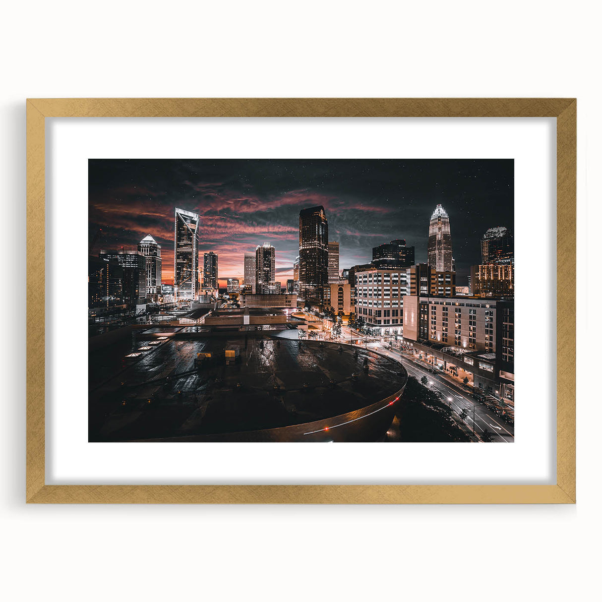 Extra large abstract art print of Charlotte skyline in muted gray tones on a textured canvas, framed in gold.