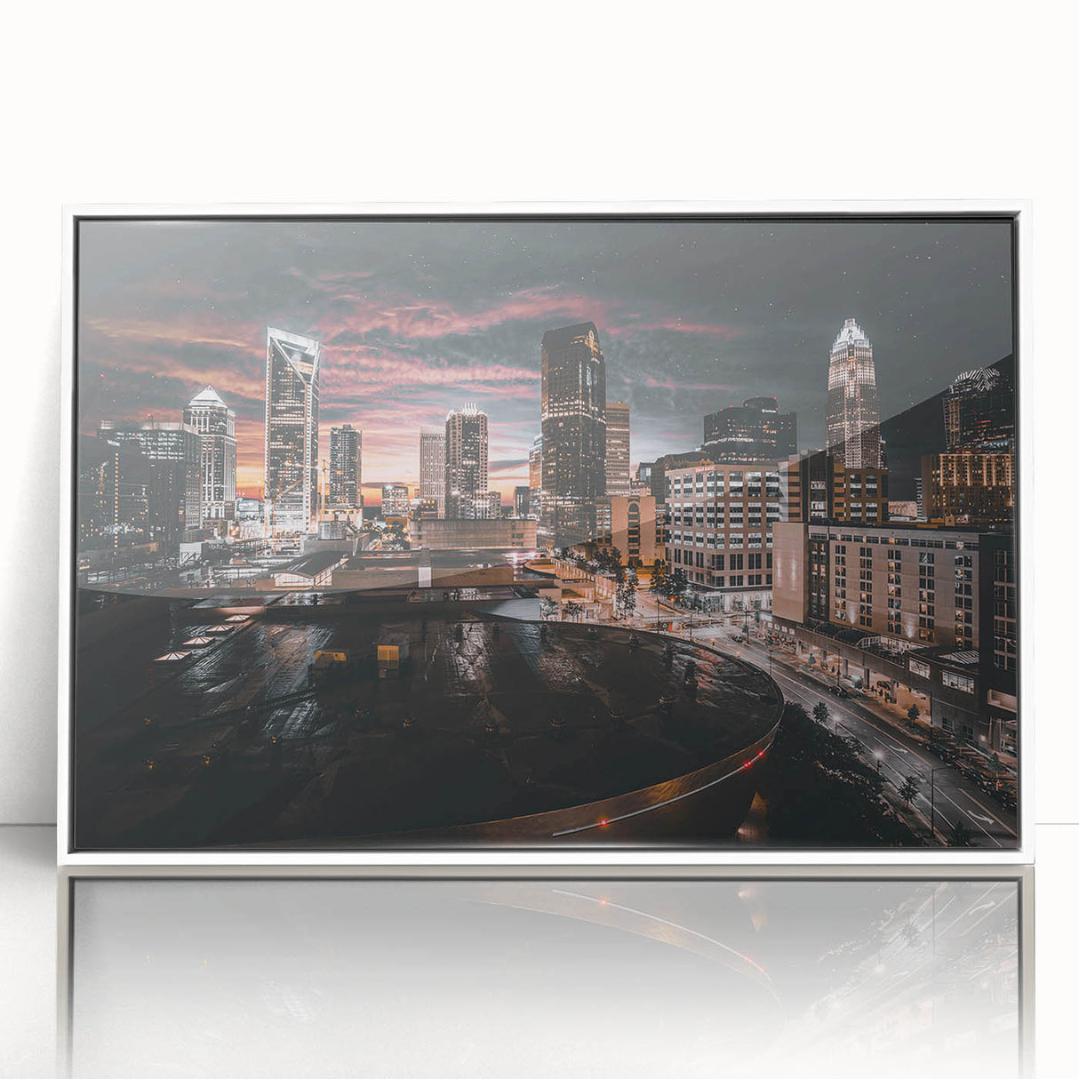 Art deco poster of Charlotte, North Carolina skyline in muted gray, acrylic print framed in white.