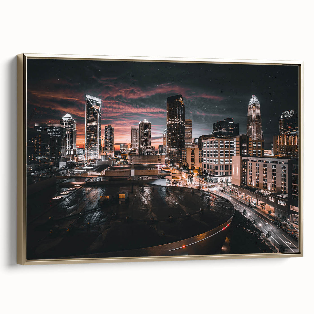 Framed canvas wall art featuring a vintage-style landscape of Charlotte, North Carolina in muted gold and black tones.