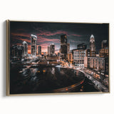Framed canvas wall art featuring a vintage-style landscape of Charlotte, North Carolina in muted gold and black tones.