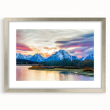 Textured art print of the Grand Tetons in muted earth tones on a framed silver mat, suitable for bedroom decor.