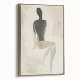 Framed abstract figurative canvas art in gold, showcasing elegant lines and shapes, perfect for modern decor, viewed from the side against a neutral background.