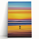 Abstract landscape stretched canvas artwork displaying vibrant hues of blue, green, and orange, leaning against a neutral wall, ideal for modern home decor.